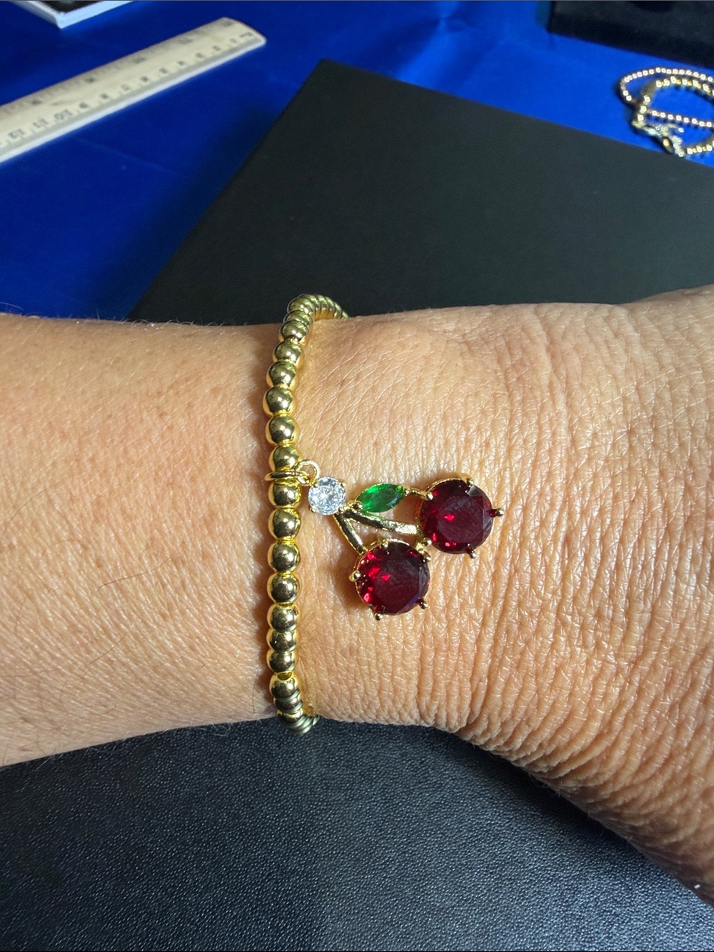 Gold Beaded Bracelet with Red Cherry Charm